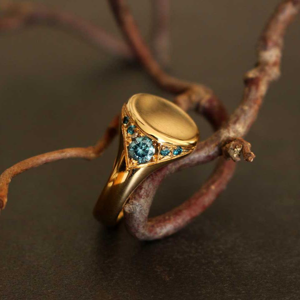 gold ring with blue diamonds (signet ring)