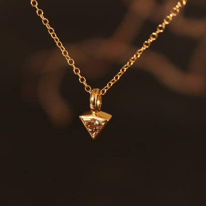 gold pendant with natural brown diamond