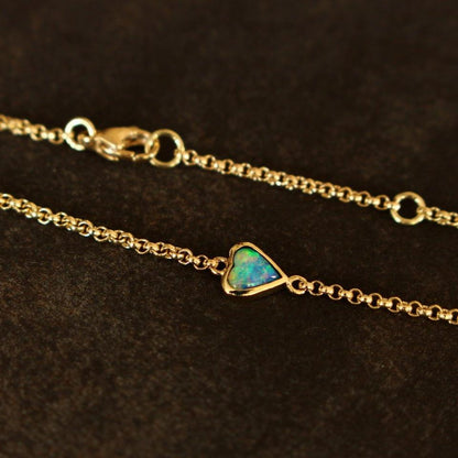 Gold bracelet with opal heart 14ct.