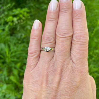 white gold ring with colorless sapphire