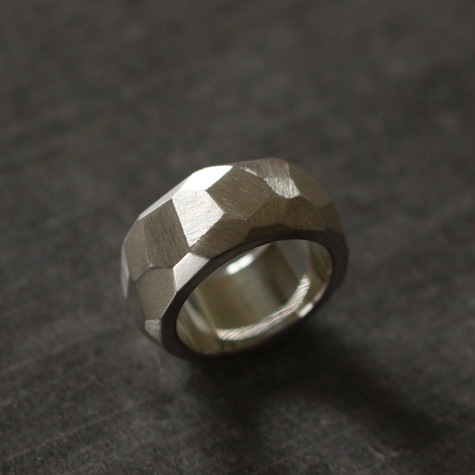 Solid silver ring with facets