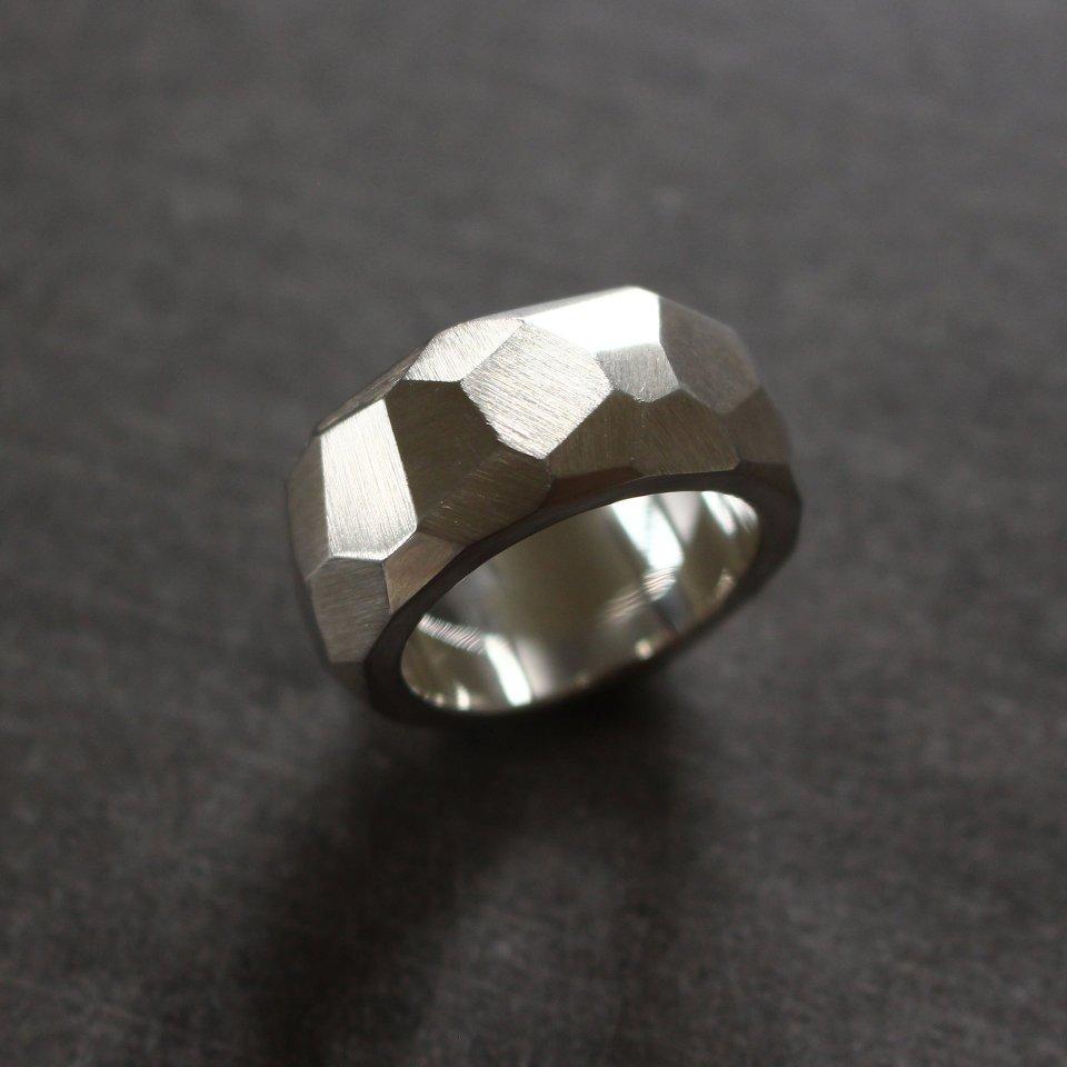 Solid silver ring with facets