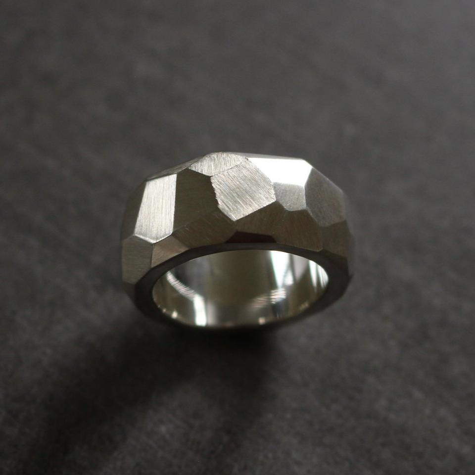 Solid silver ring with facets