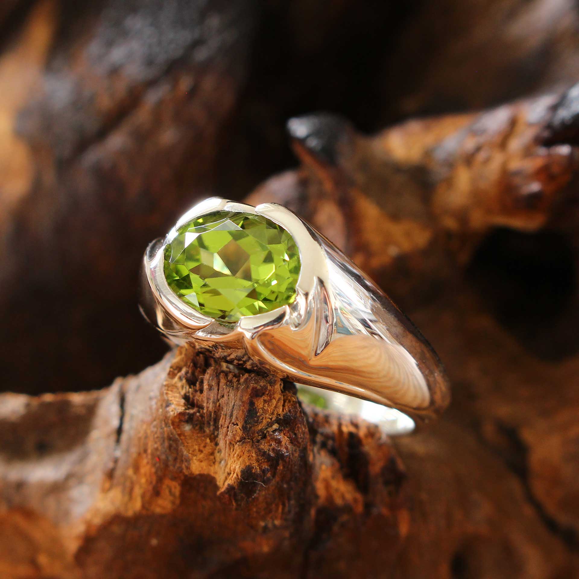 silver ring floral with peridot