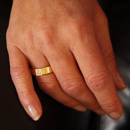 gold ring with princess-cut diamond