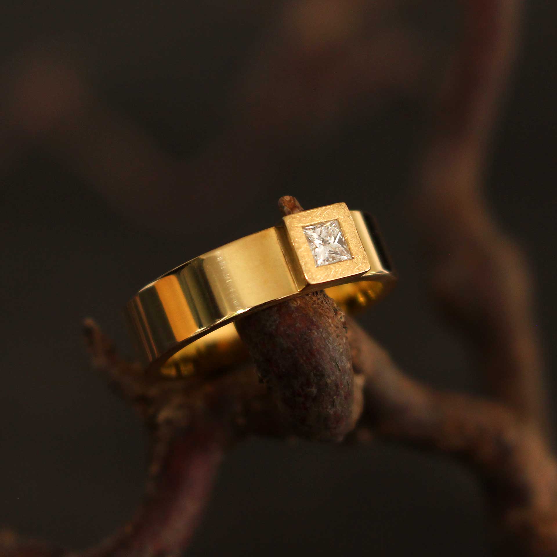 gold ring with princess-cut diamond