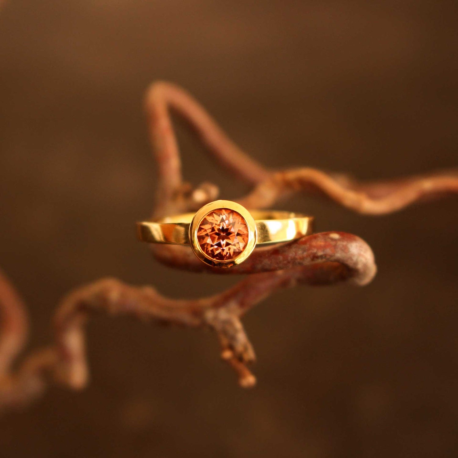 gold ring with cognac-colored zircon