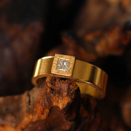 gold ring with princess-cut diamond