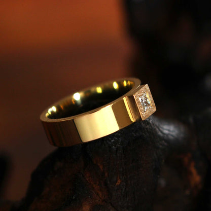 gold ring with princess-cut diamond