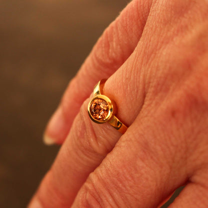 gold ring with cognac-colored zircon