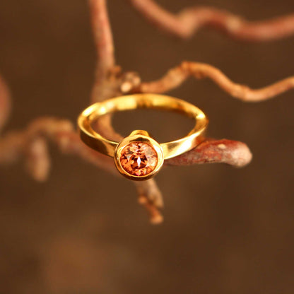 gold ring with cognac-colored zircon