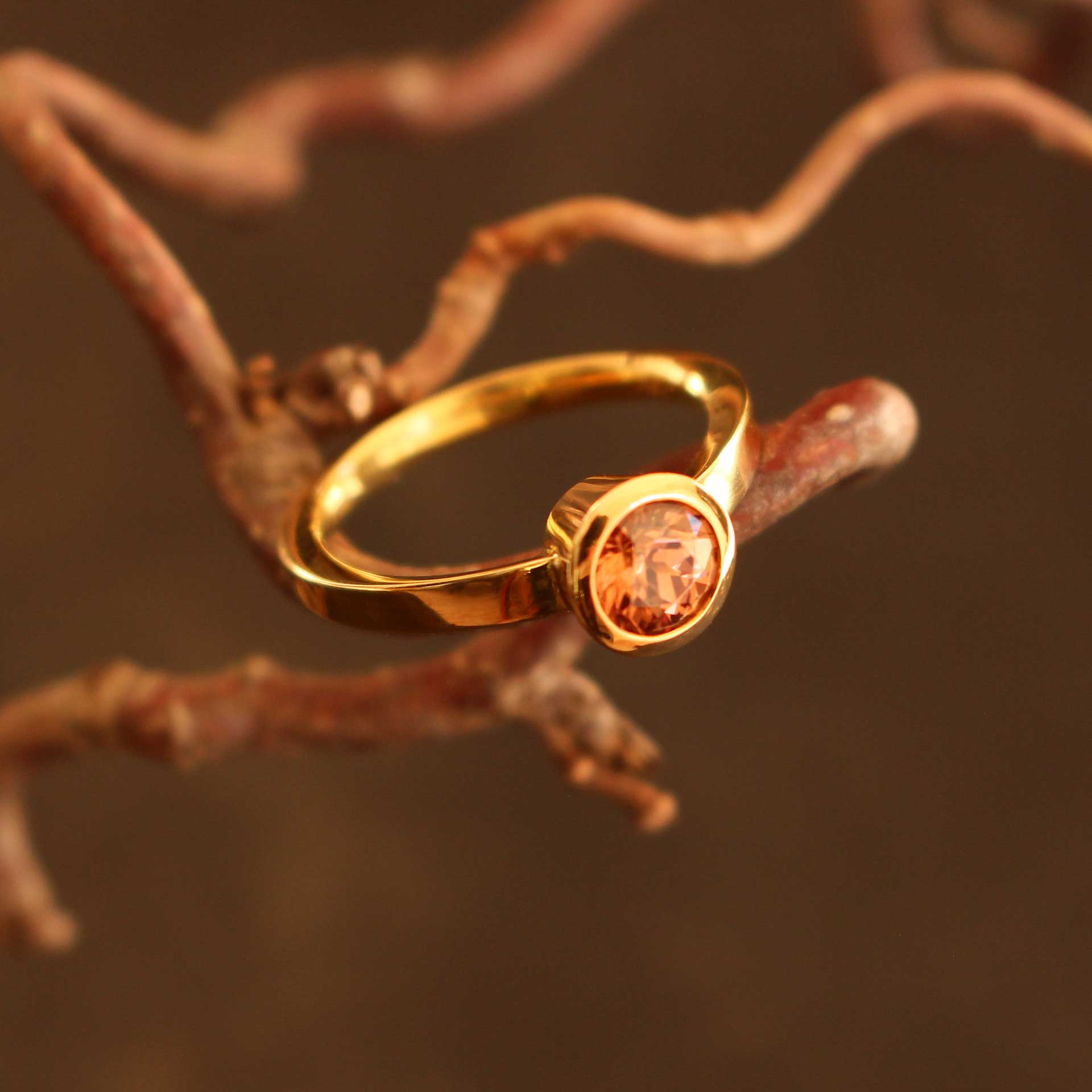 gold ring with cognac-colored zircon