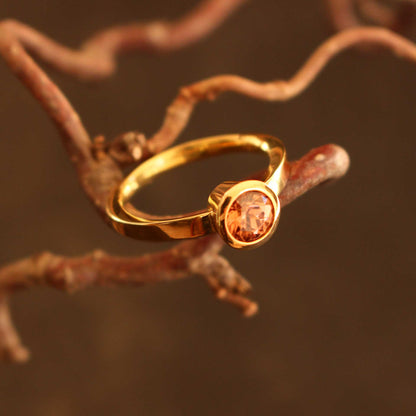 gold ring with cognac-colored zircon