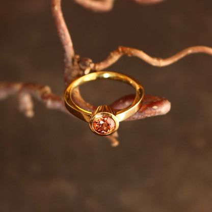 gold ring with cognac-colored zircon