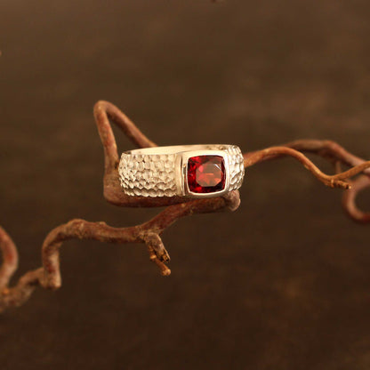 Silver ring with faceted antique cut garnet