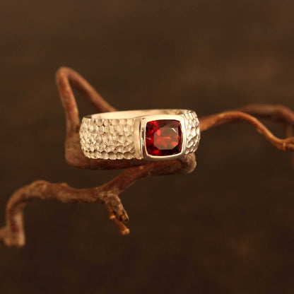 Silver ring with faceted antique cut garnet