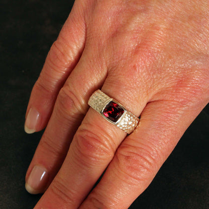 Silver ring with faceted antique cut garnet